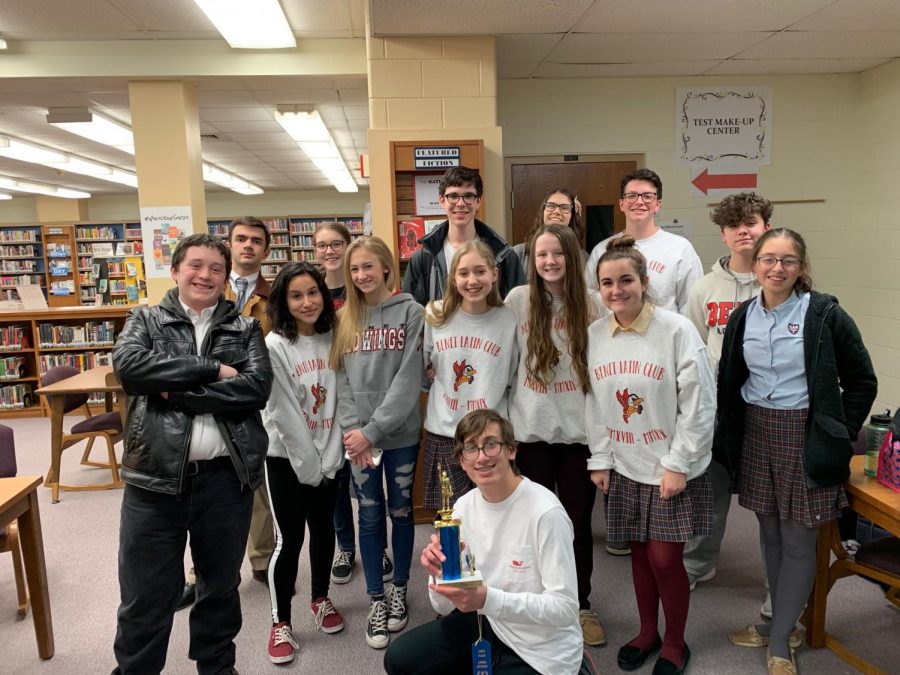 Certamen+Team%0AWith+trophy%3A+Jack+Burns%3B+Front+row+%28L+to+R%29%3A+Christopher+Wiesner%2C+Lily+Myszak%2C+Kadee+Swanson%2C+Claire+Bosch%2C+Josie+Schwab%2C+Kylie+Flynn%2C+Kasia+Takla%3B+Back+Row%3A+Michael+Wulffe%2C+Cara+Gould%2C+Amani+Naseem%2C+Kaylie+Scorza%2C+Michael+Beirne%2C+Pierce+Salbego