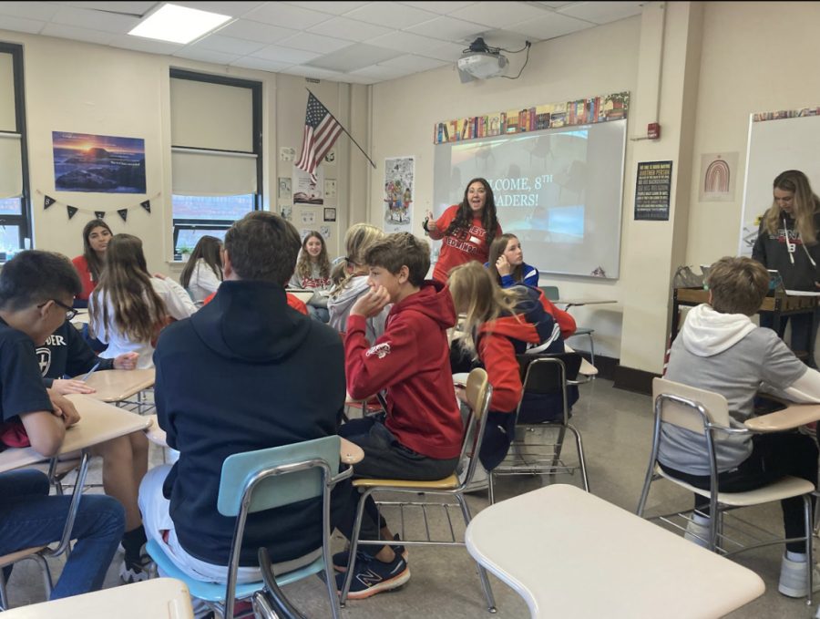 Potential Redwings sit in a classroom while getting to know one of Benet Academys teachers.