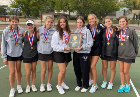 The Benet Academy girls varsity tennis team show off their conference win. 