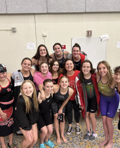 The Girl’s Swim team celebrates 3 state qualifying swimmers 