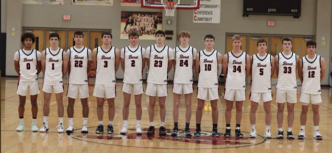 The Benet Academy boys varsity basketball team line up for a picture. 