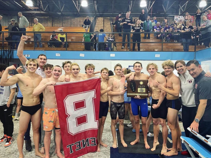 The+Benet+Academy+boys+swim+team+poses+for+a+picture+after+their+win+at+sectionals.