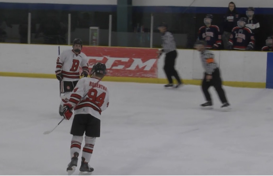 The+Benet+Academy+Boys%E2%80%99+Hockey+Team+skates+during+the+State+Playoffs.+