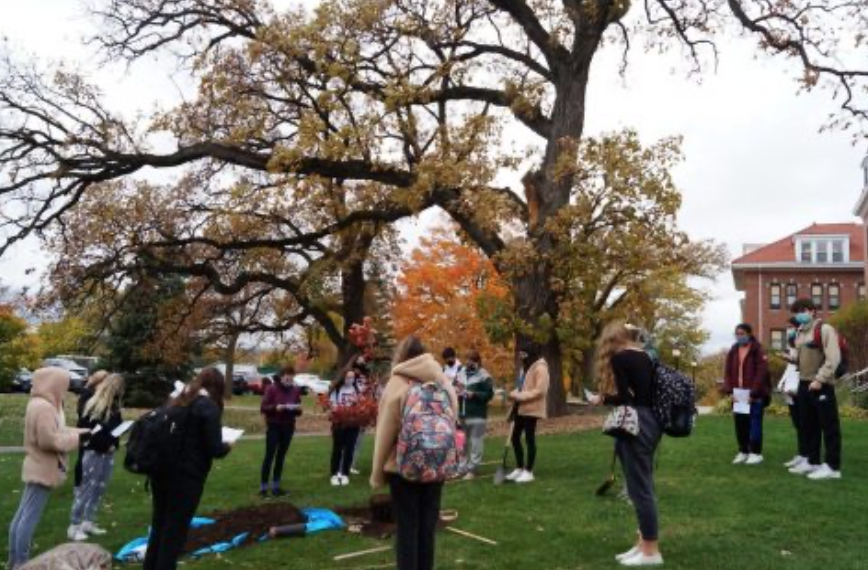 This area outside Benet Hall is where many trees are on campus. Here, Benet Academy students who are a part of Environmental Club plant a tree in 2021. 