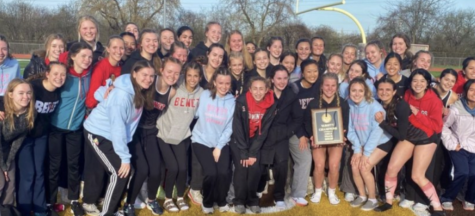 Benet Academys girls track team poses for a group picture after their conference win.