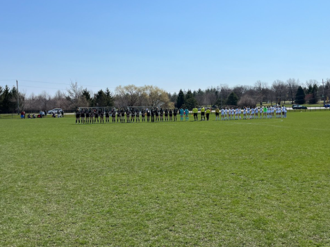 Benet Academy and Carmel Catholic Girls Soccer line up before the beginning of their game.