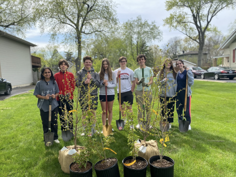 Benet Academy students from Environmental Club plant trees on Arbor Day