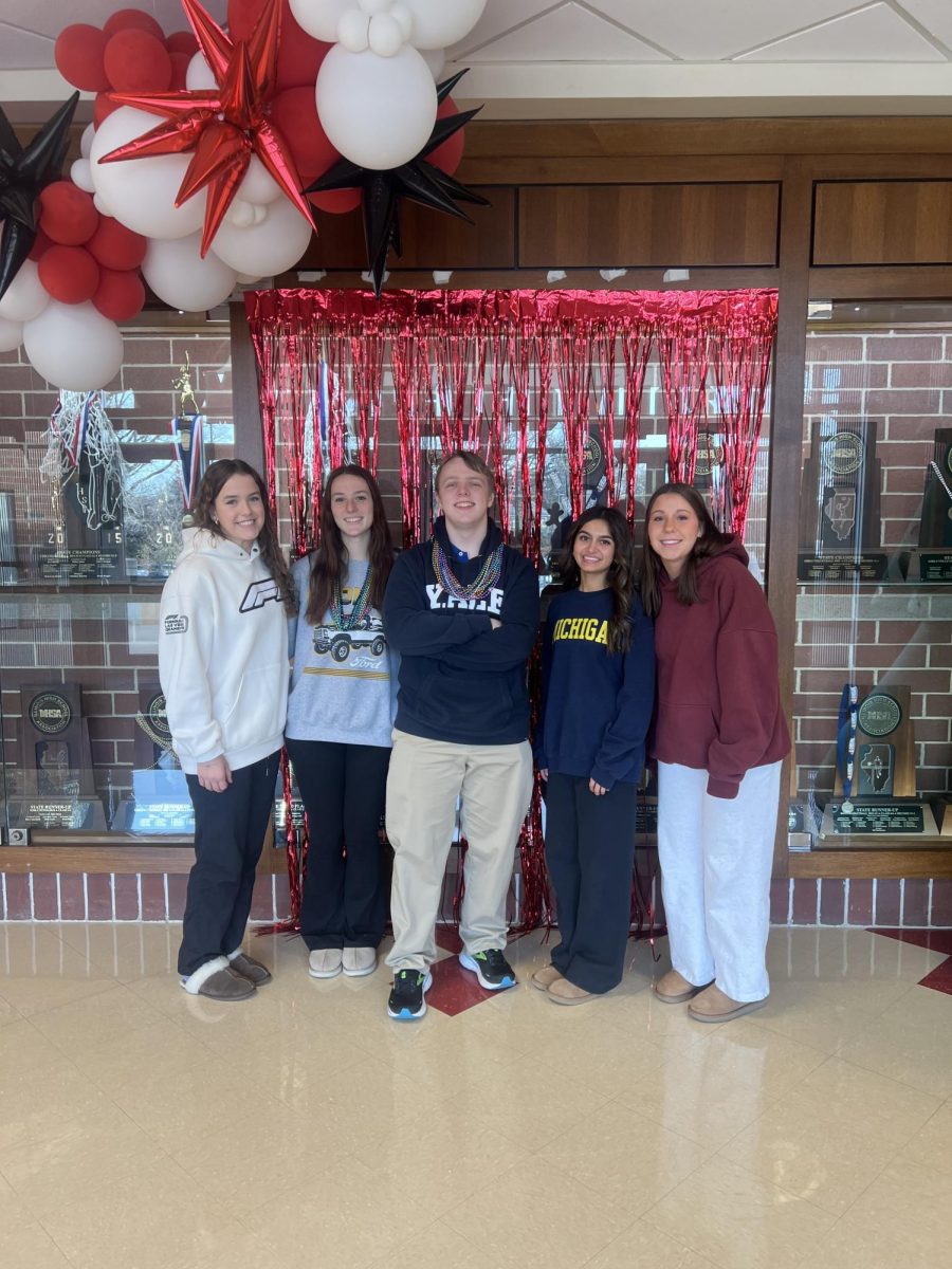 The top four finishers of You’ve Been Elfed are shown above, as well as the primary organizer, John Augustyn. Pictured left to right: Imogen Duffy (4th), Kate Pohodich (3rd), John Augustyn (Organizer), Diya Patel (First), and Junior Grace Cline (Second).