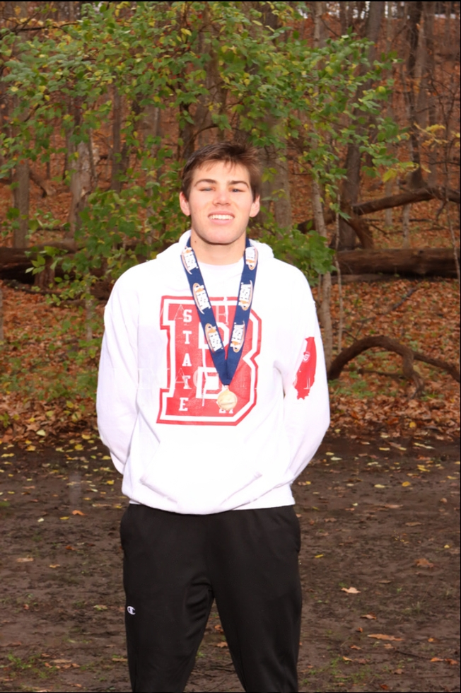 A photo of Finn Richards at the IHSA Awards Ceremony for Cross Country.