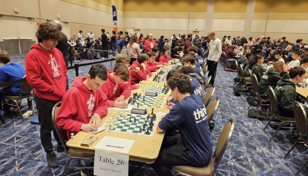 Junior, Jake Wittman engages in a challenging match against his opponent.