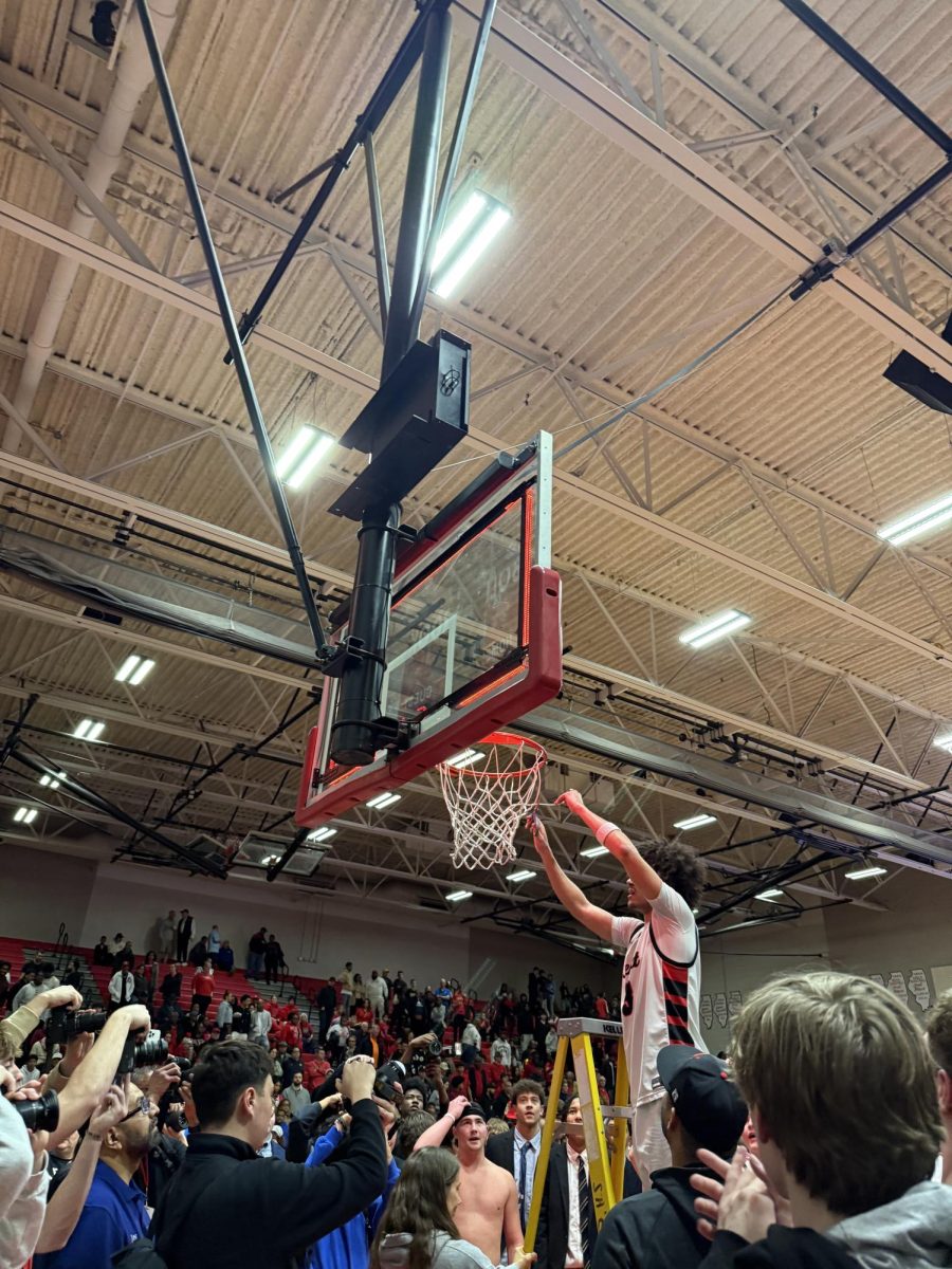 Jayden Wright cutting down the net at Bolingbrook. 