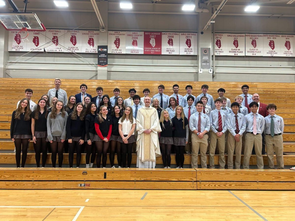 Fr. Lorang with St. Raphael alumni who are now current Benet faculty members or students